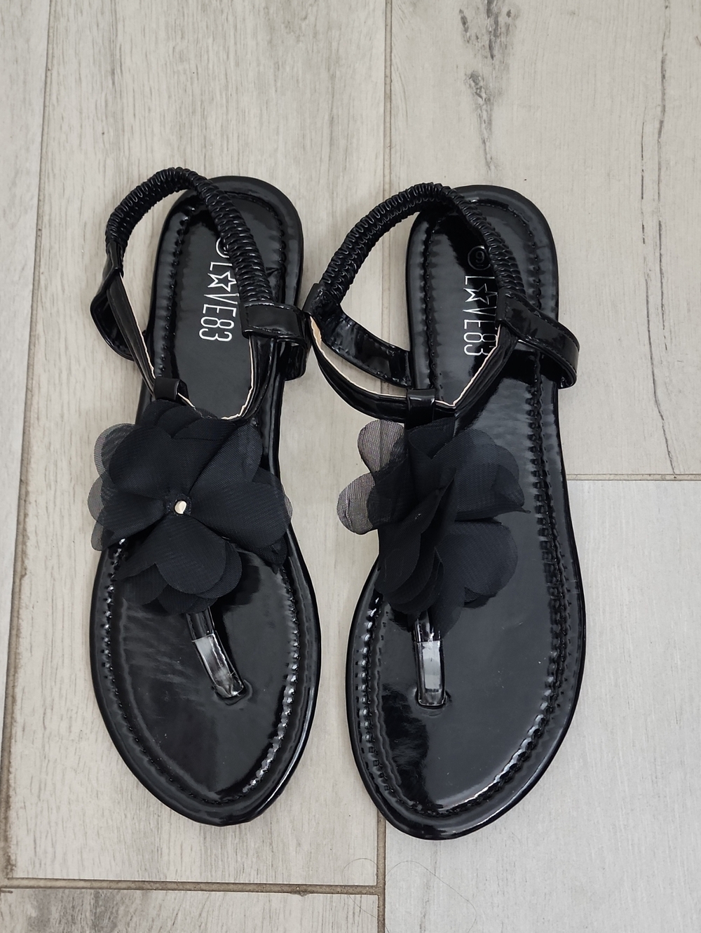 Love83 Black Floral T-Strap Sandals with Fabric Bloom
